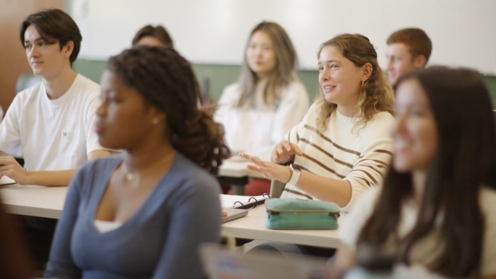 Student discusses topic in classroom