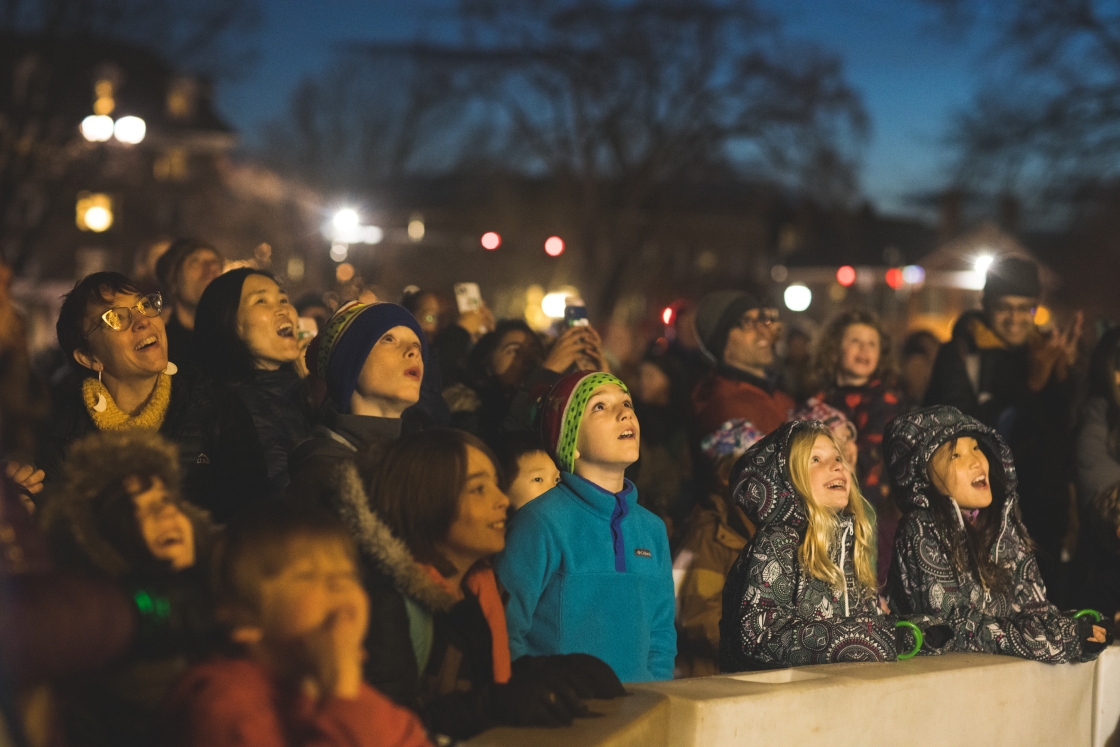 Children and families admiring the Christmas tree