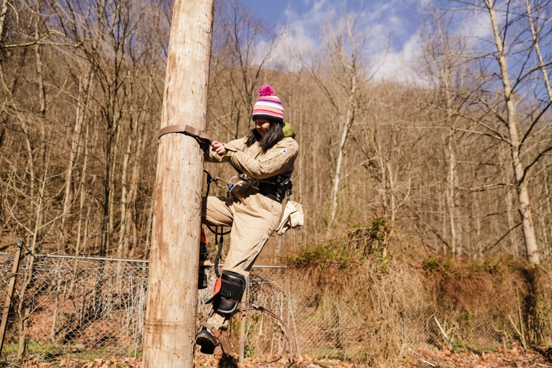 Joanne Liu practicing scaling a telephone pole