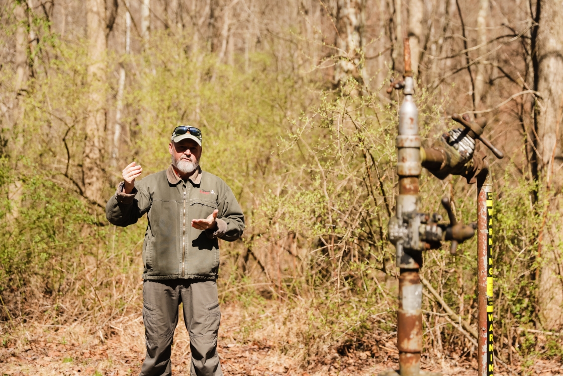 Eddy Grey in the hoods near piping for gas drilling