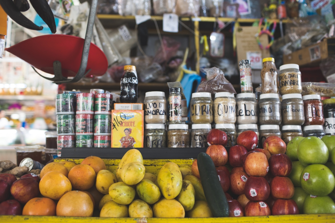 Assorted spices and fruits in a traditional Mexican Mercado