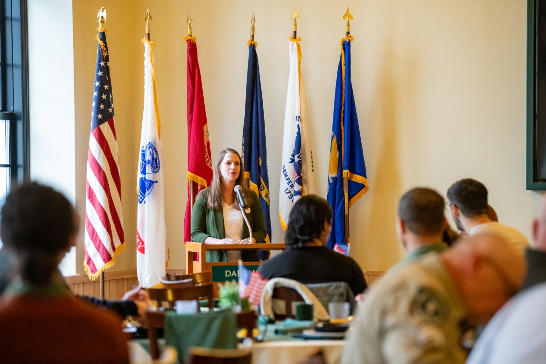 Morgan Ogreen at the podium during Veterans Day breakfast