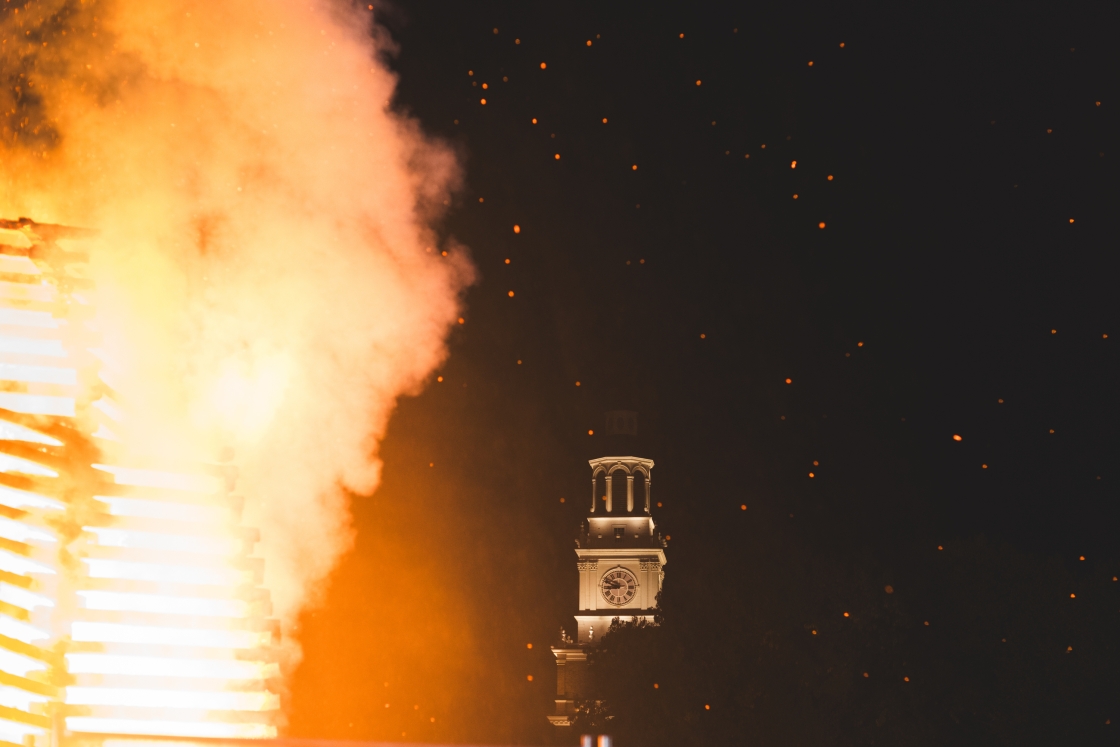 Baker Tower framed by flames