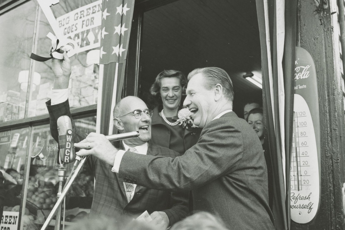 Nelson Rockefeller in downtown Hanover with merchant