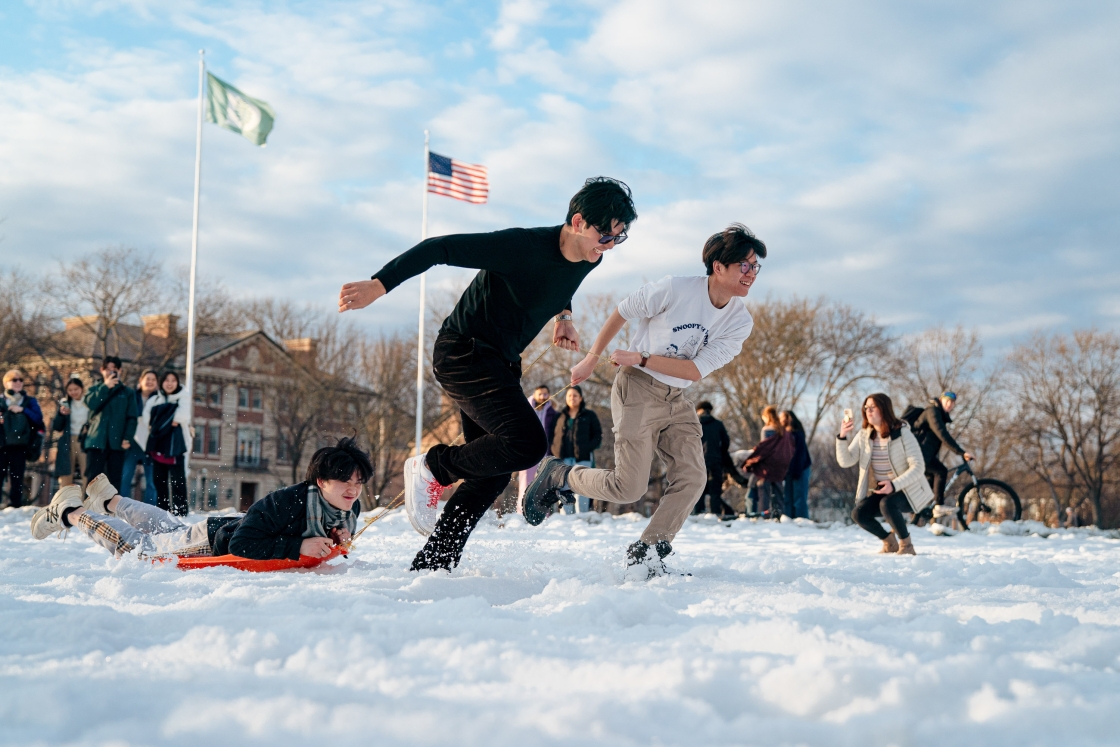 Students drag classmates on sleds