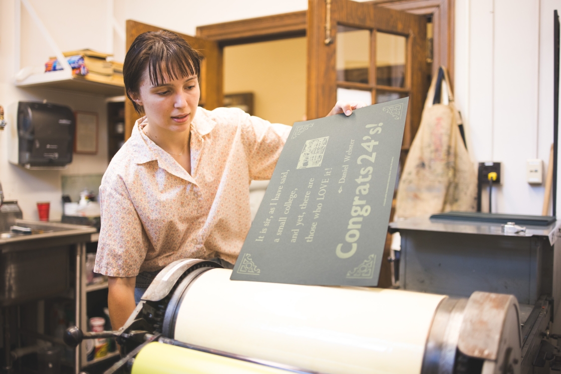 Yuliya Subotskaya rolling a poster