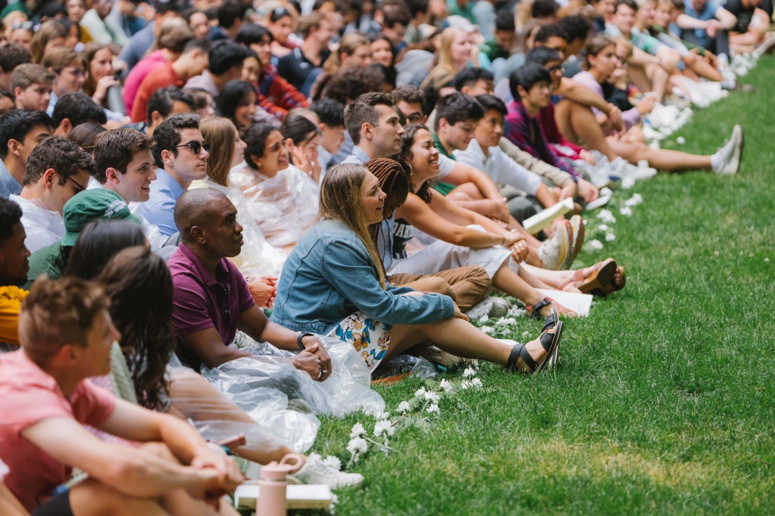 Students sitting in the grass