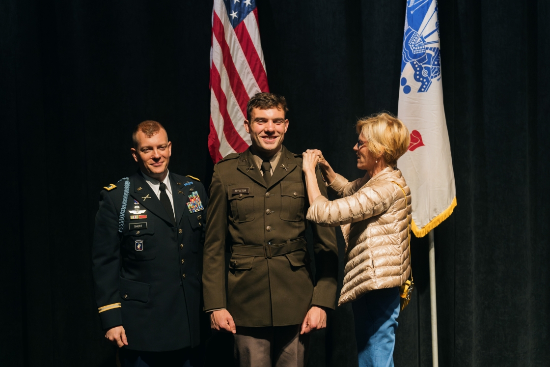 Sara Appleton pins second lieutenant bars on her son David