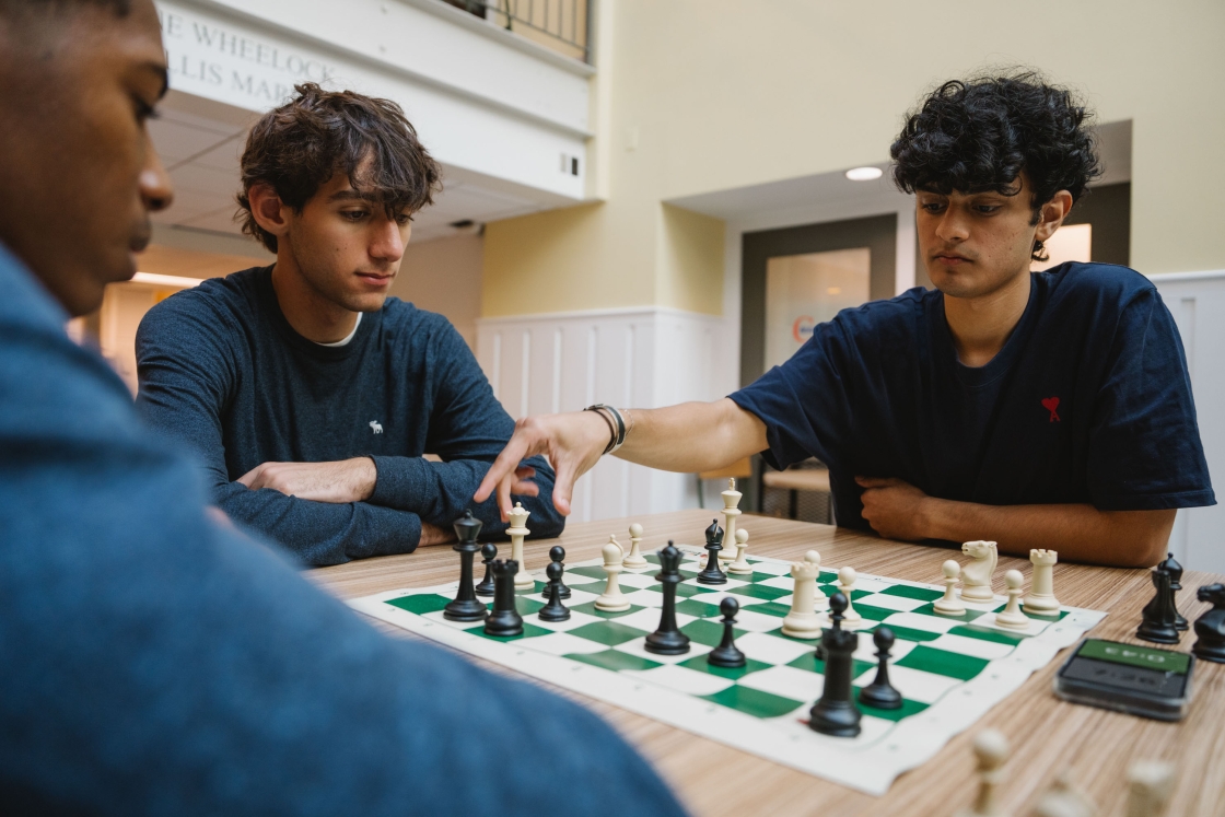 Students playing chess.