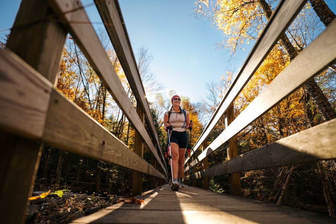 Jordan Miller treks across a bridge