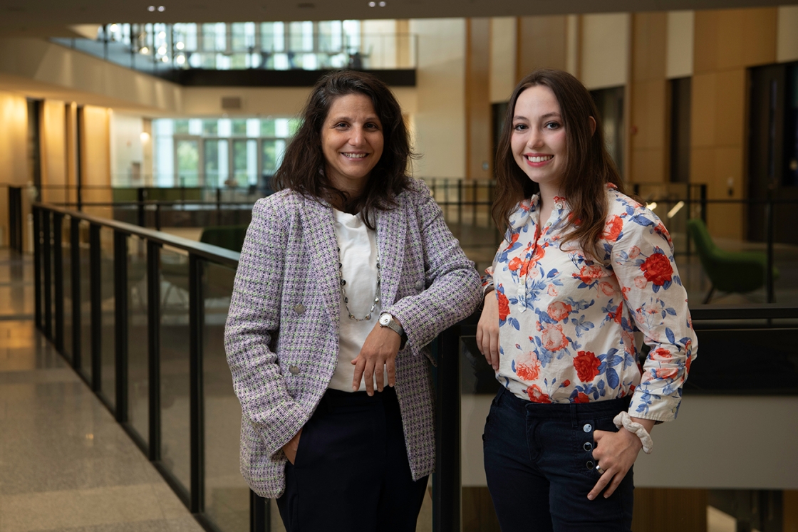 A photo of professor Karen Fortuna standing next to student Julia Hill