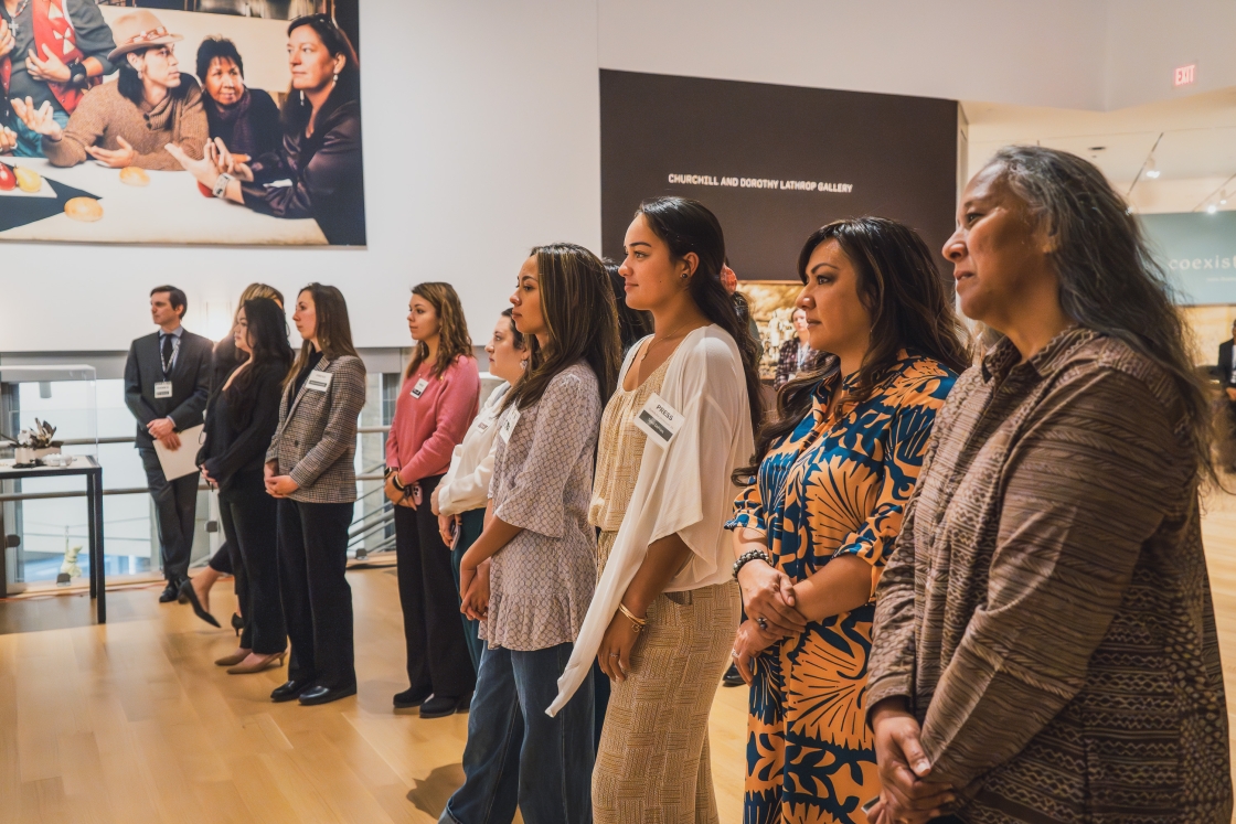 Students from the Native American Program and members of the press gathered for a tour