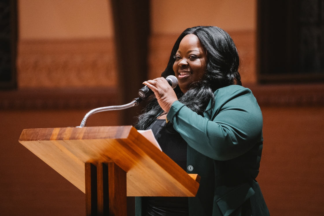 Dr. La-Tarri Canty giving the main address at a podium