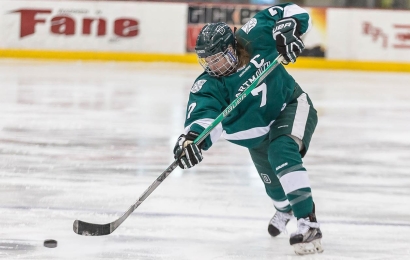 Hockey player Laura Stacey takes a shot on goal.