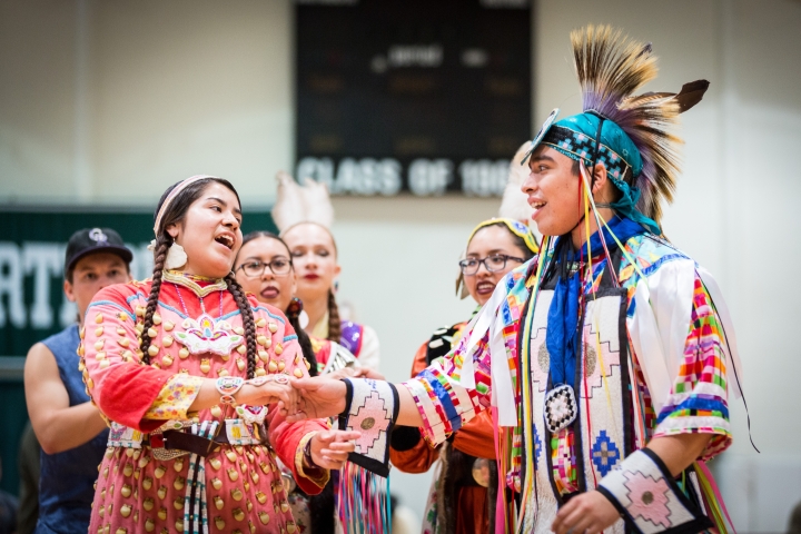 A man and woman in traditional Native American dress
