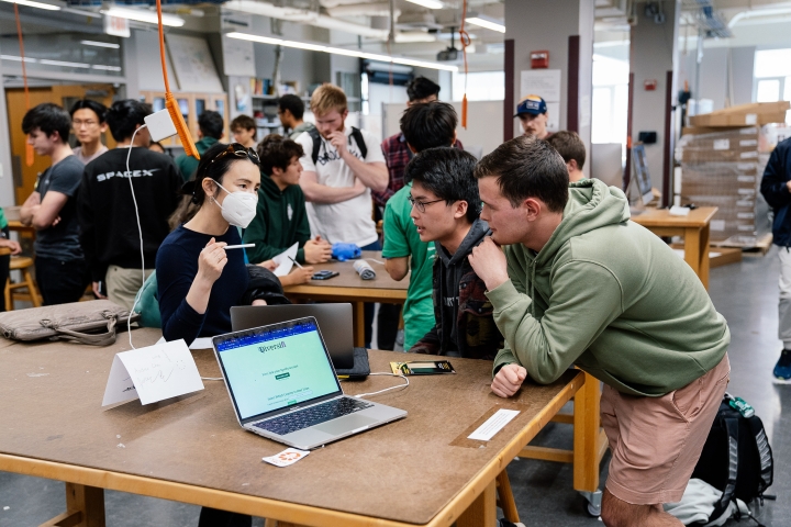 HackDartmouth participants with judge