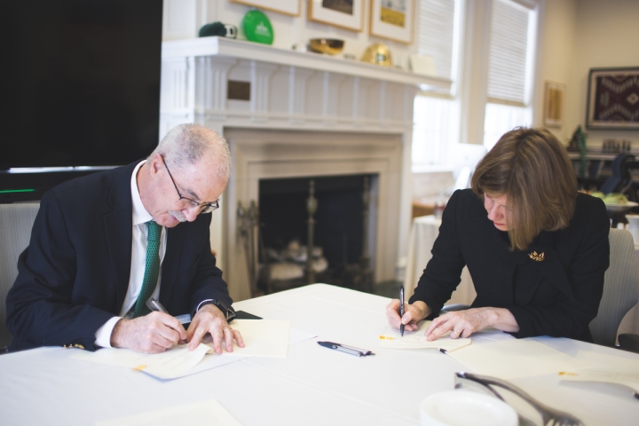 President Hanon and President Rawda Awwad signing documents