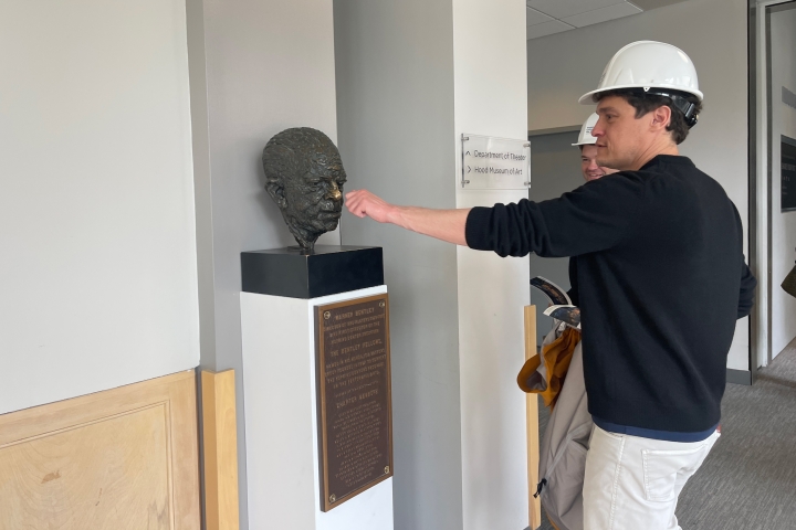 Phil Lord rubs nose of statue