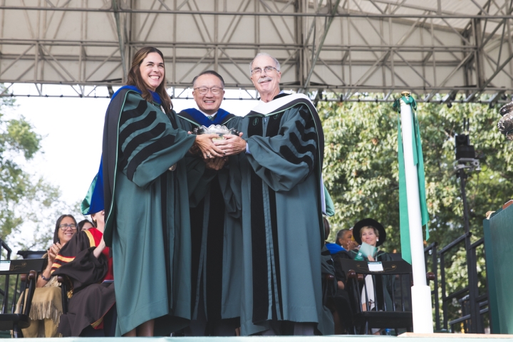 Sian Beilock, Jim Kim, and Philip Hanlon hold the Wentworth Bowl