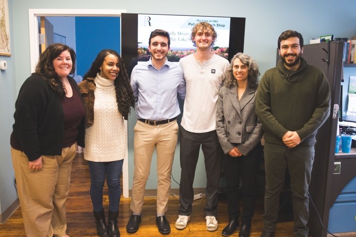 Group poses together after presentation