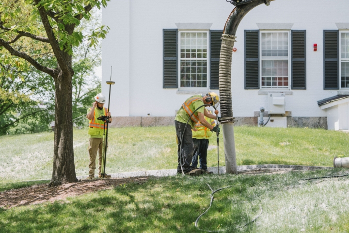 R.H. White employees surveying underground utilities