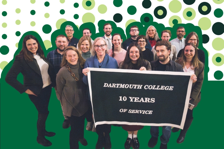 A group of Dartmouth College employees celebrating 10 years of service stand and smile