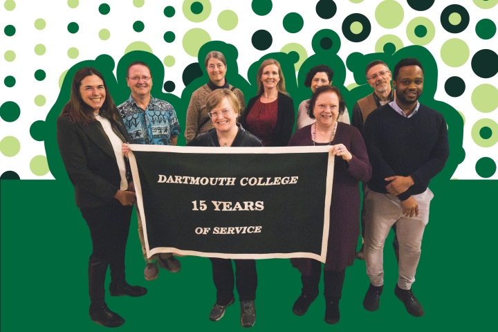 A group of Dartmouth College employees celebrating 15 years of service stand and smile