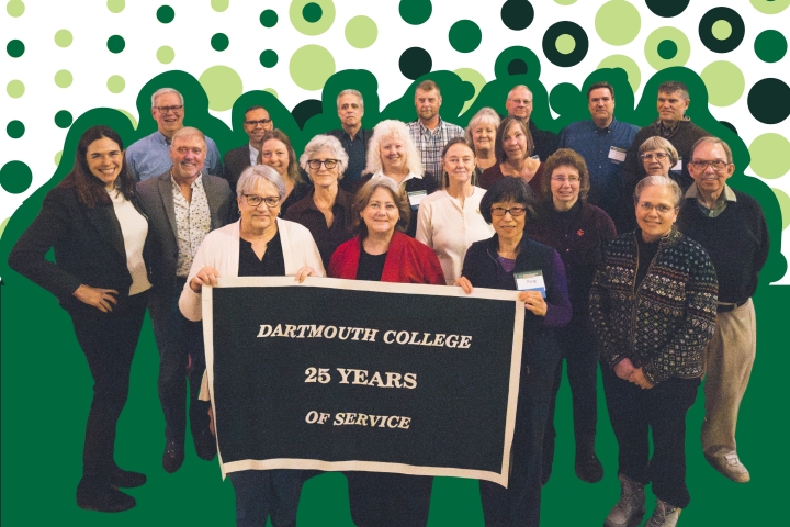 A group of Dartmouth College employees celebrating 25 years of service stand and smile