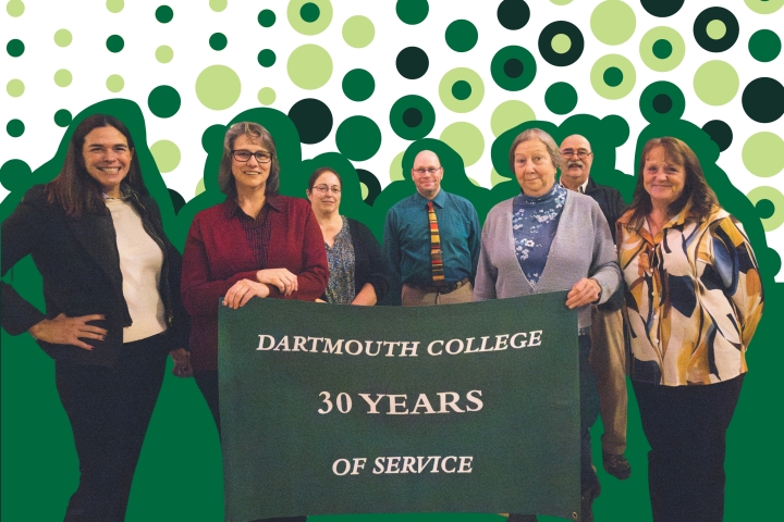 A group of Dartmouth College employees celebrating 30 years of service stand and smile