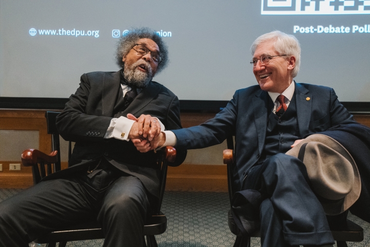 Cornel West and Robert George shaking hands