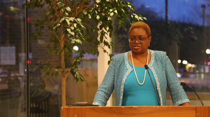 Leah Daughtry standing at a podium delivering a speech