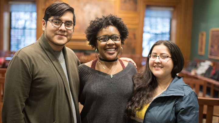 three students standing side by side