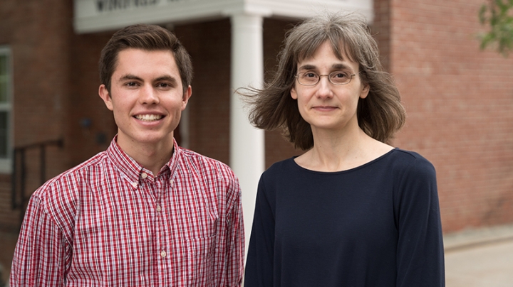 Kevin Griffee ’19 and Professor of Education Donna Coch standing together outside