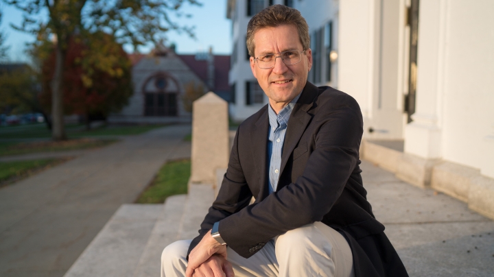 David Kotz sitting on steps of Dartmouth Hall