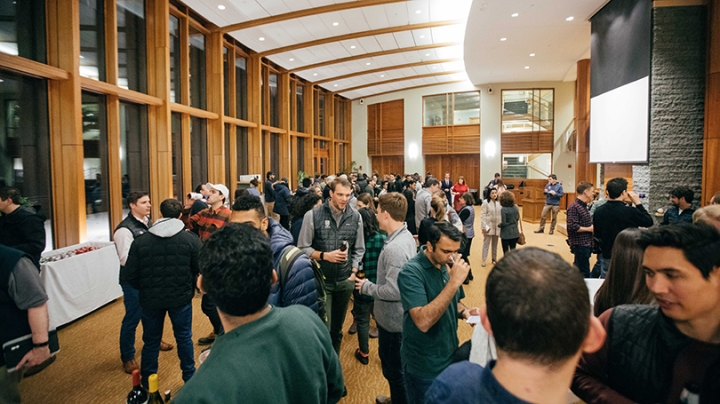 Tuck School of Business students mingle in Raether Hall