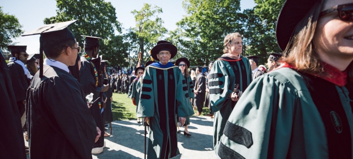 At center, Trustee James Jackson marches with Trustee Jeffrey Blackburn '91 during last year's commencement ceremony.