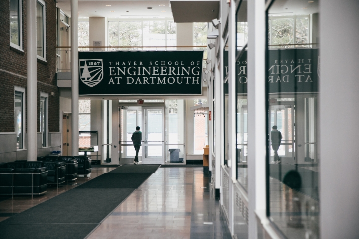 Student exits the Thayer lobby 