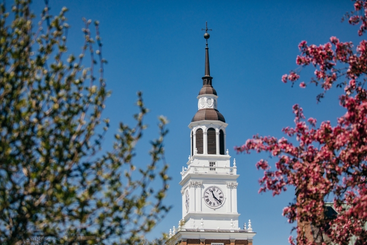 Baker Tower framed by budding tree branches