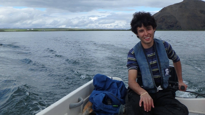 Aldo Arellano riding in a motorboat
