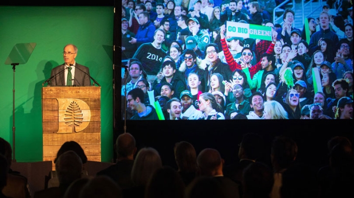 Hanlon speaking from a podium