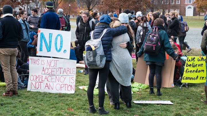 students hugging during a protest on the Green.