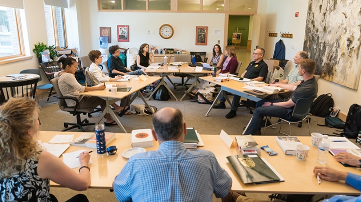 Elisabeth Parrott ’95, second from left, talks about the book groups for veterans at the conference