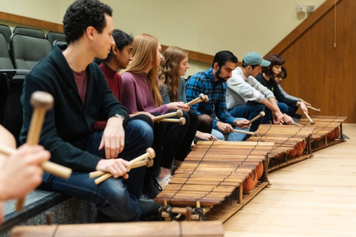 Students play balafons in a