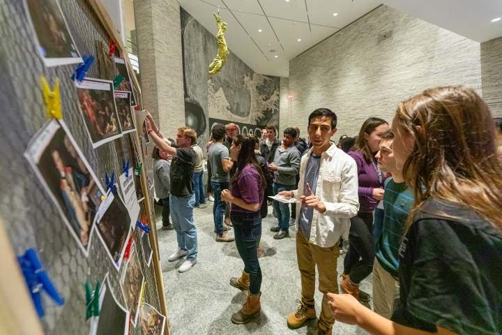 Students compete in a contest during Hood After 5, writing funny captions for art in the museum's collection.
