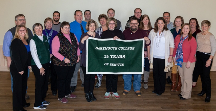 Employees who have worked for 15 years for the college stand together for a group photo