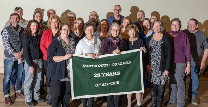 Employees who have worked for 25 years for the college stand together for a group photo