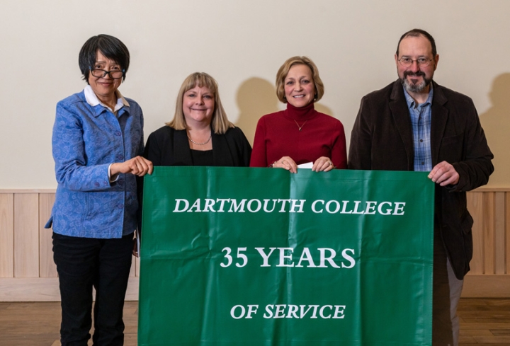 Employees who have worked for 35 years for the college stand together for a group photo